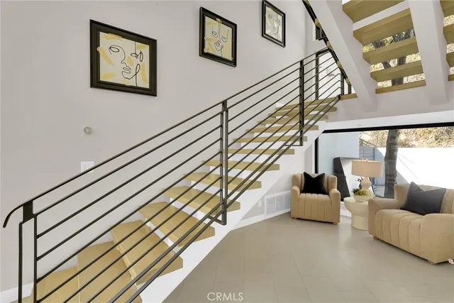 a spacious bathroom with a granite countertop sink a mirror and a window
