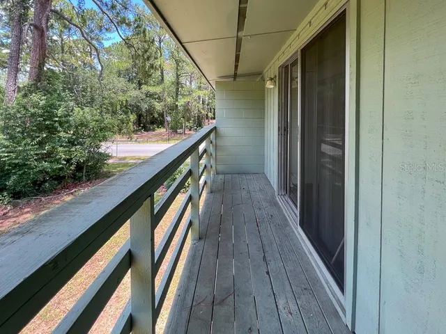 a view of balcony and wooden floor