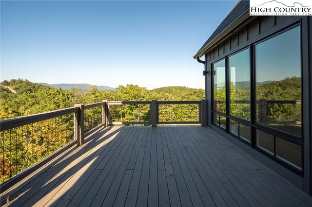 a view of a balcony with wooden floor