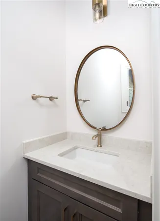 a bathroom with a sink and mirror