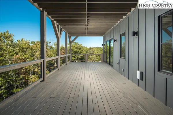 a view of balcony with wooden floor