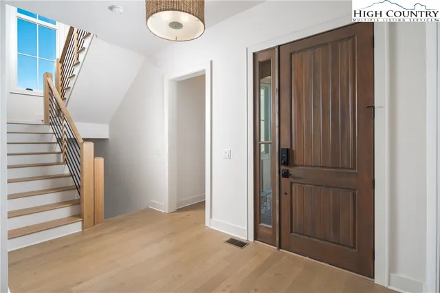 a view of entryway with wooden floor