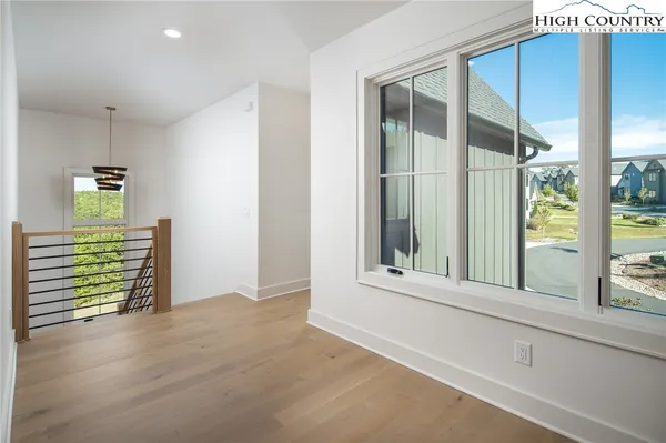 a view of a livingroom with a ceiling fan and window