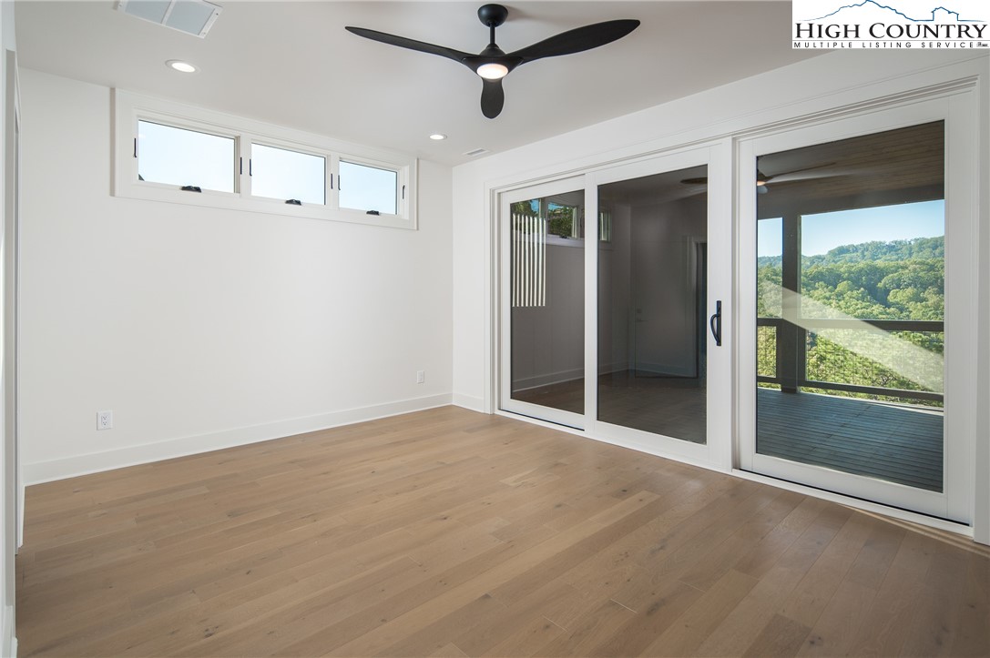 359 Calico Court Boone, NC 28607 - Photo 30 of 50 a view of a livingroom with a ceiling fan and window