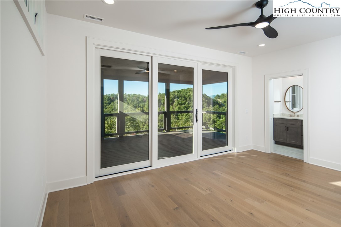 359 Calico Court Boone, NC 28607 - Photo 31 of 50 a view of an empty room with a window and kitchen view