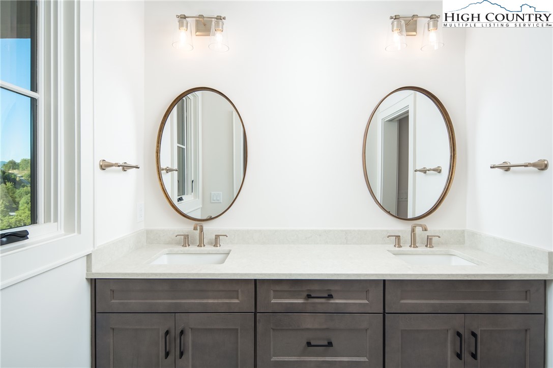 359 Calico Court Boone, NC 28607 - Photo 32 of 50 a bathroom with a sink and a mirror