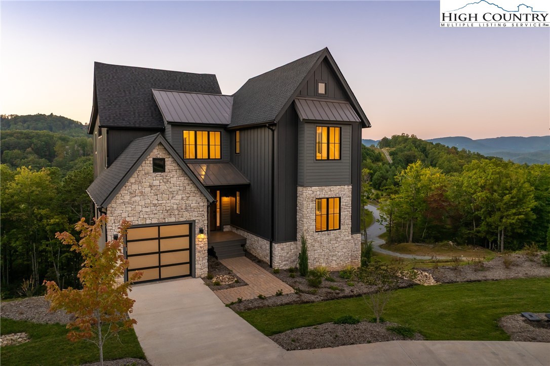 359 Calico Court Boone, NC 28607 - Photo 35 of 50 a front view of a house with garden