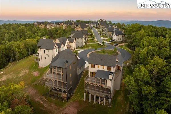 a view of a town with mountains in the background