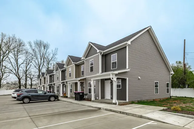 a view of street with parked cars