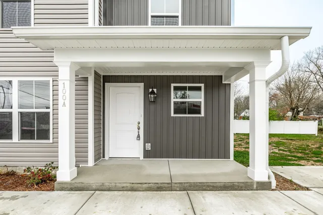 a view of a house with a small garden