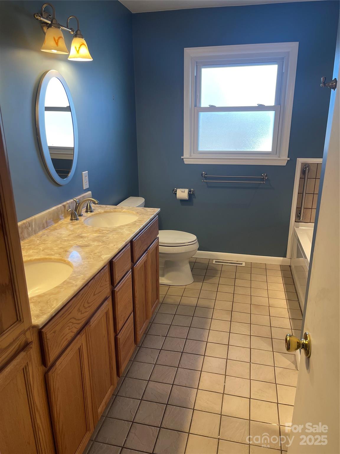 14701 Beckenham Drive Charlotte, NC 28227 - Photo 11 of 19 a bathroom with a sink a toilet and a mirror