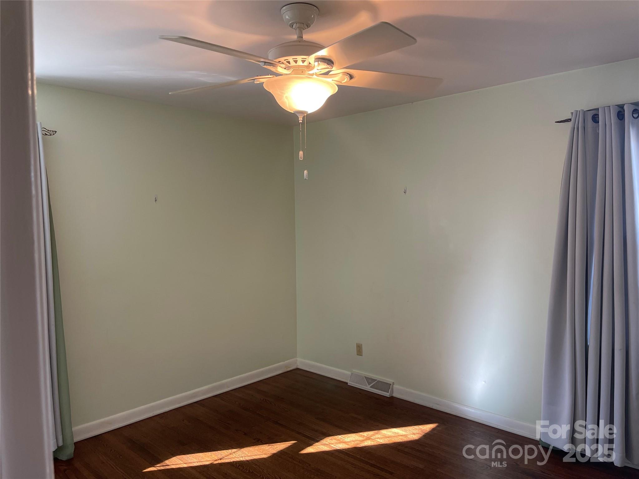 14701 Beckenham Drive Charlotte, NC 28227 - Photo 18 of 19 a view of a room with a hanging light and a window