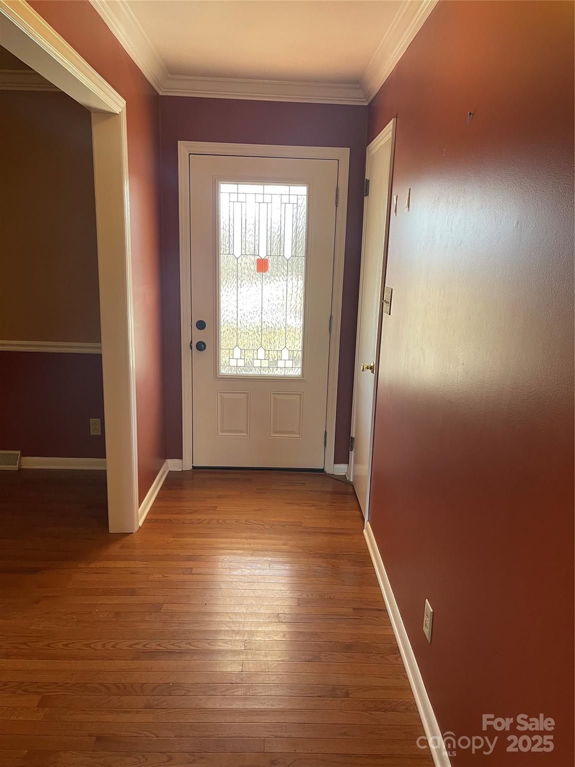 14701 Beckenham Drive Charlotte, NC 28227 - Photo 3 of 19 an empty room with wooden floor and windows
