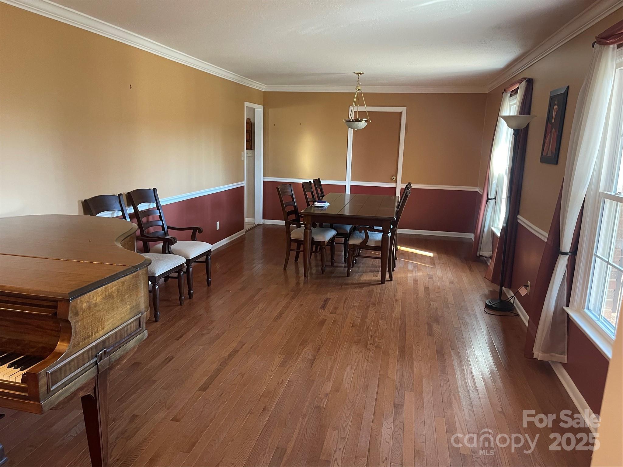 14701 Beckenham Drive Charlotte, NC 28227 - Photo 4 of 19 a view of a dining room with furniture and wooden floor