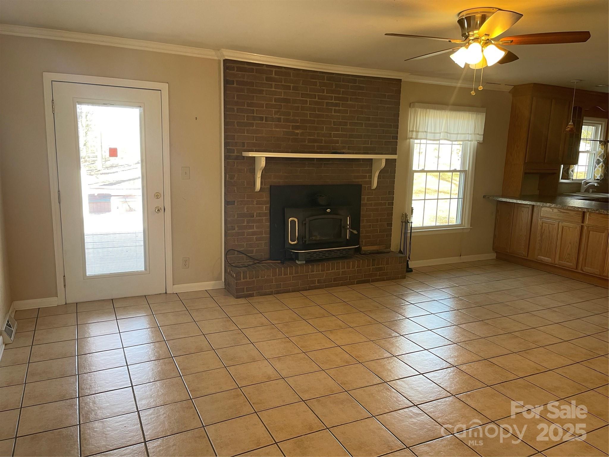 14701 Beckenham Drive Charlotte, NC 28227 - Photo 6 of 19 a view of an empty room with a fireplace and a window