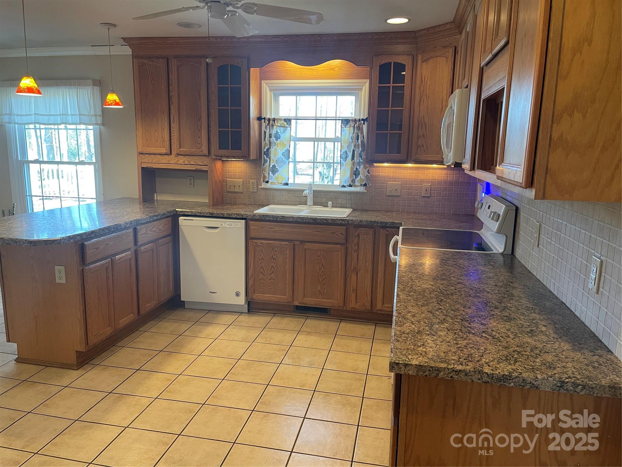 14701 Beckenham Drive Charlotte, NC 28227 - Photo 8 of 19 a kitchen with stainless steel appliances granite countertop a sink and a stove