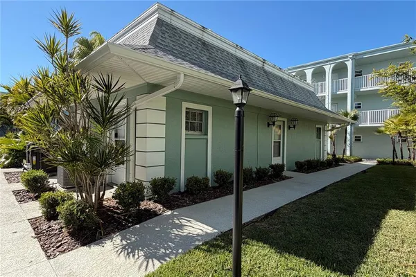 a view of a livingroom with furniture and a window