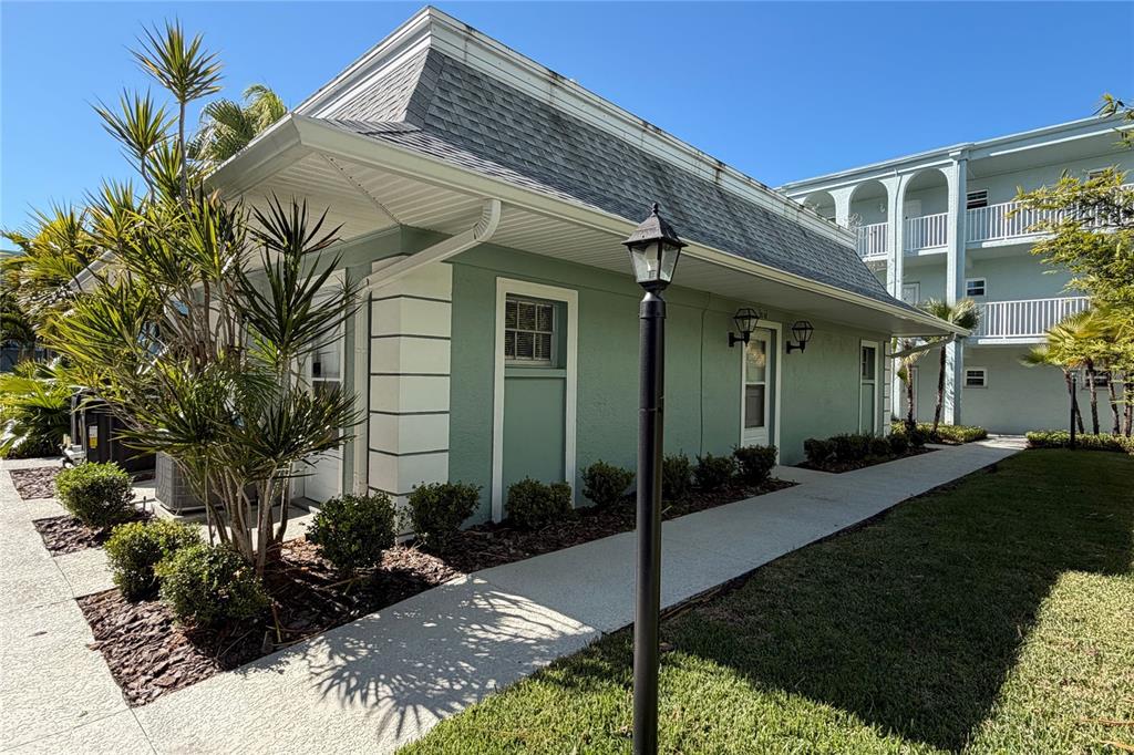 701 Poinsettia Road, Unit 340 Belleair, FL 33756 - Photo 20 of 24 a front view of a house with garden
