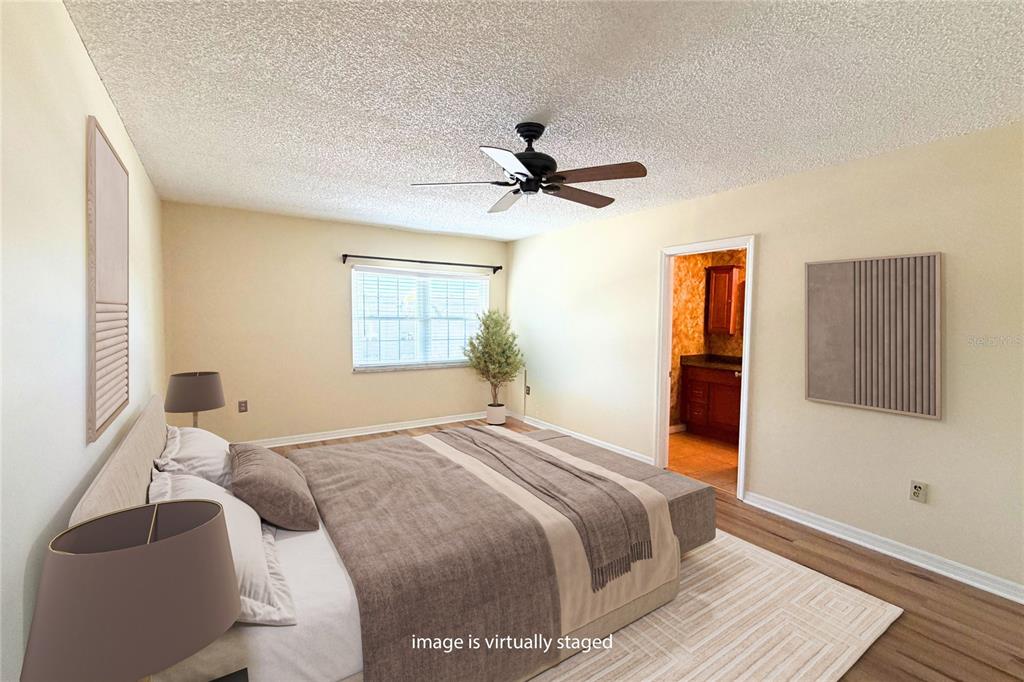 701 Poinsettia Road, Unit 340 Belleair, FL 33756 - Photo 8 of 24 a bedroom with a bed and a window