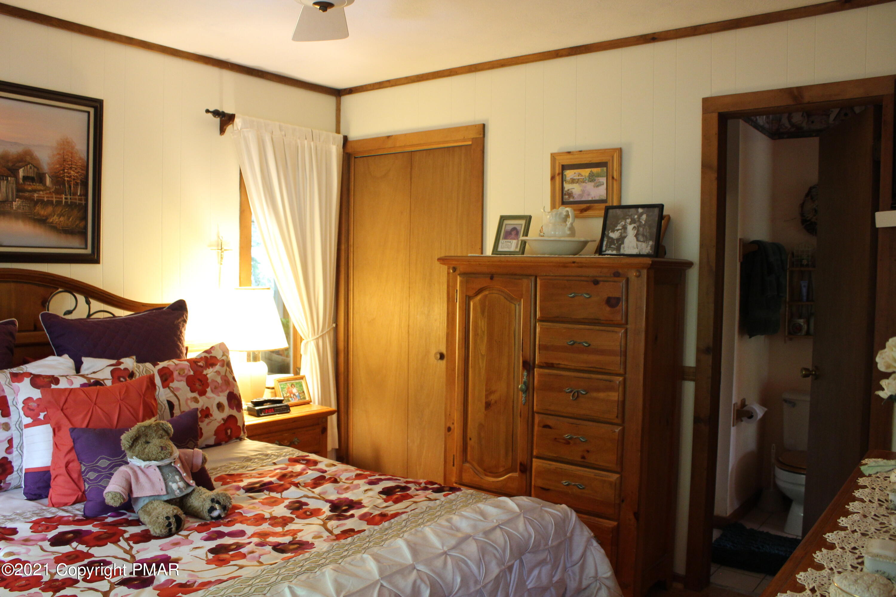 4208 Winchester Way Bushkill, PA 18324 - Photo 16 of 44 a bedroom with a bed and a dresser