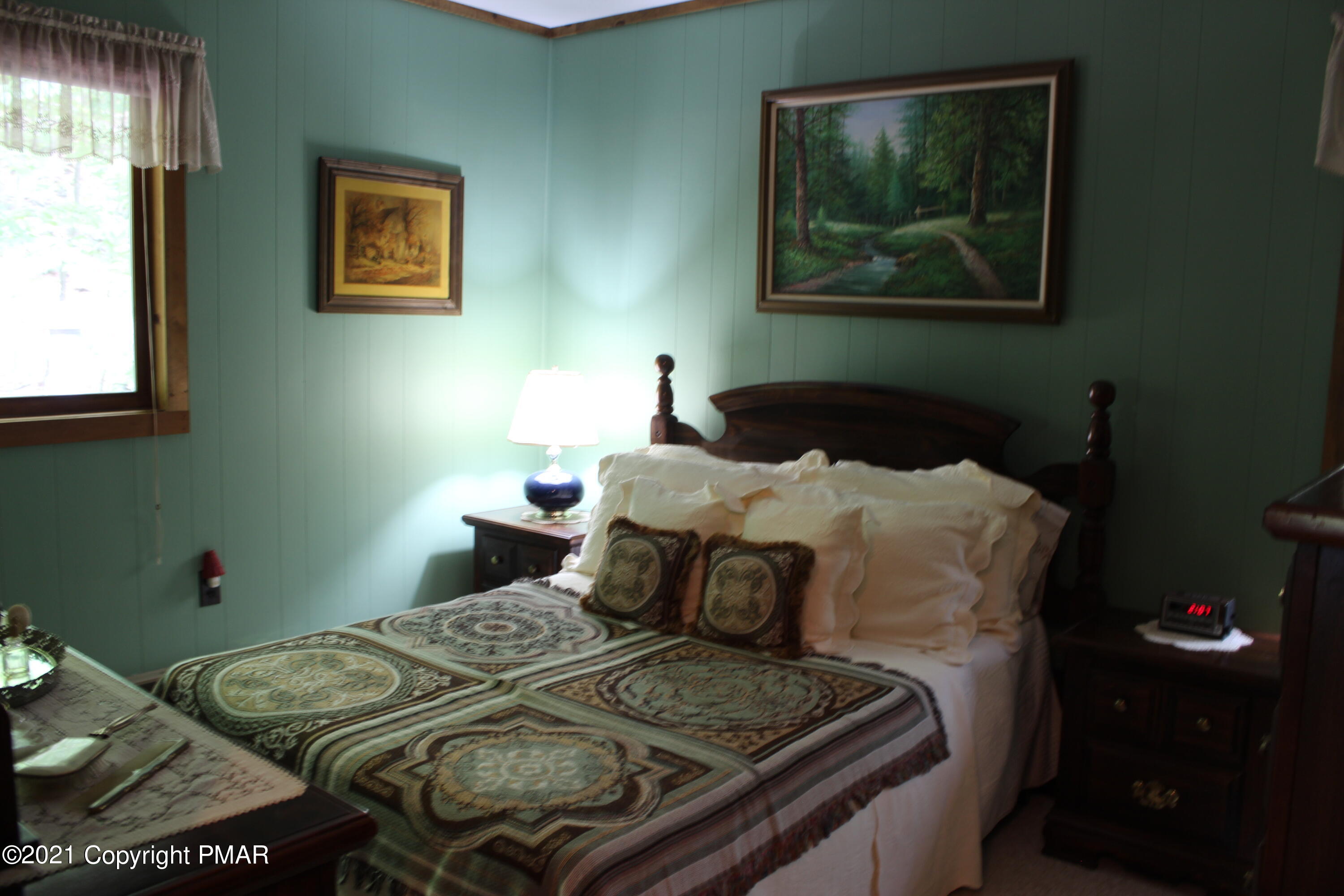 4208 Winchester Way Bushkill, PA 18324 - Photo 21 of 44 a bedroom with a bed and a painting on the wall