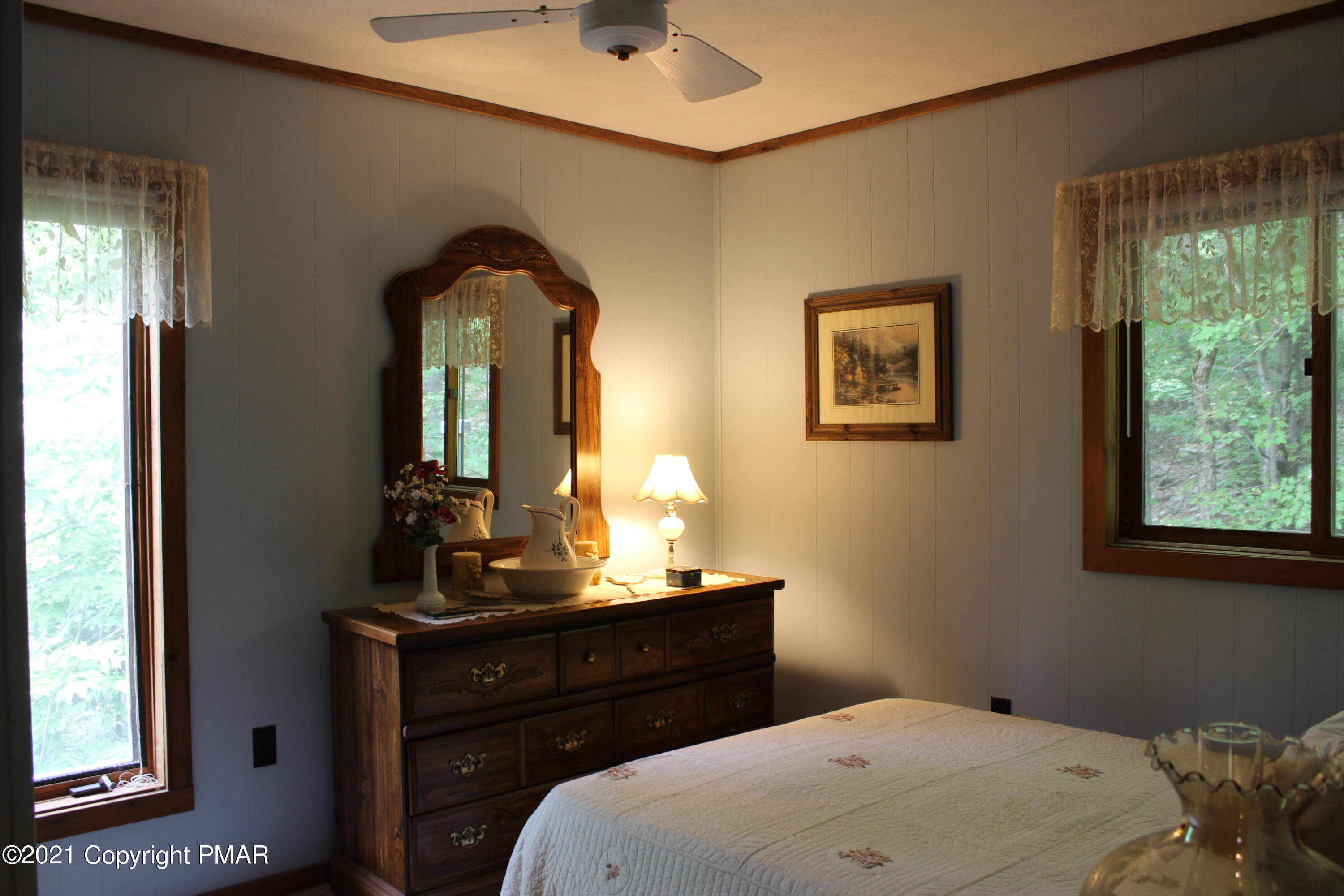 4208 Winchester Way Bushkill, PA 18324 - Photo 23 of 44 a bedroom with a bed and a mirror
