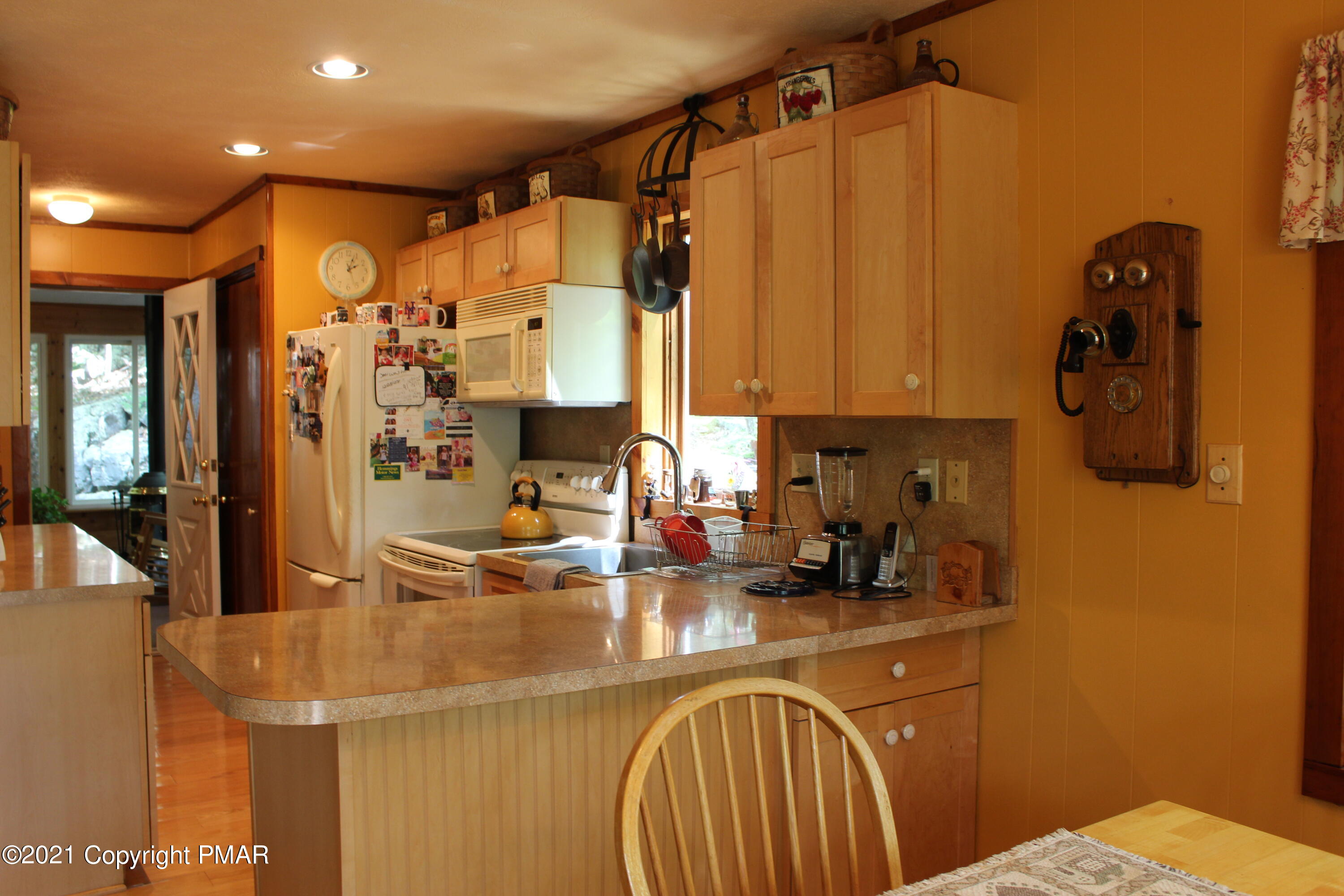 4208 Winchester Way Bushkill, PA 18324 - Photo 4 of 44 a kitchen with sink a refrigerator and cabinets