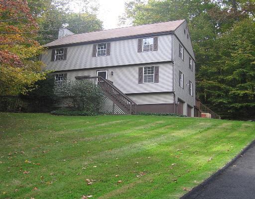107 Scodon Drive Ridgefield, CT 06877 - Photo 1 of 1 a view of a house with a yard