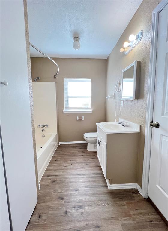 503 Pierce Street Denton, TX 76201 - Photo 8 of 12 a view of a hallway with washer and dryer