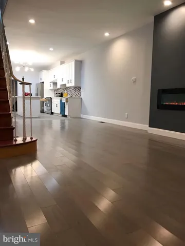 a view of a living room with a kitchen island