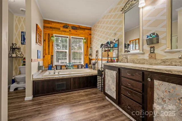 a view of granite countertop cabinets and a sink