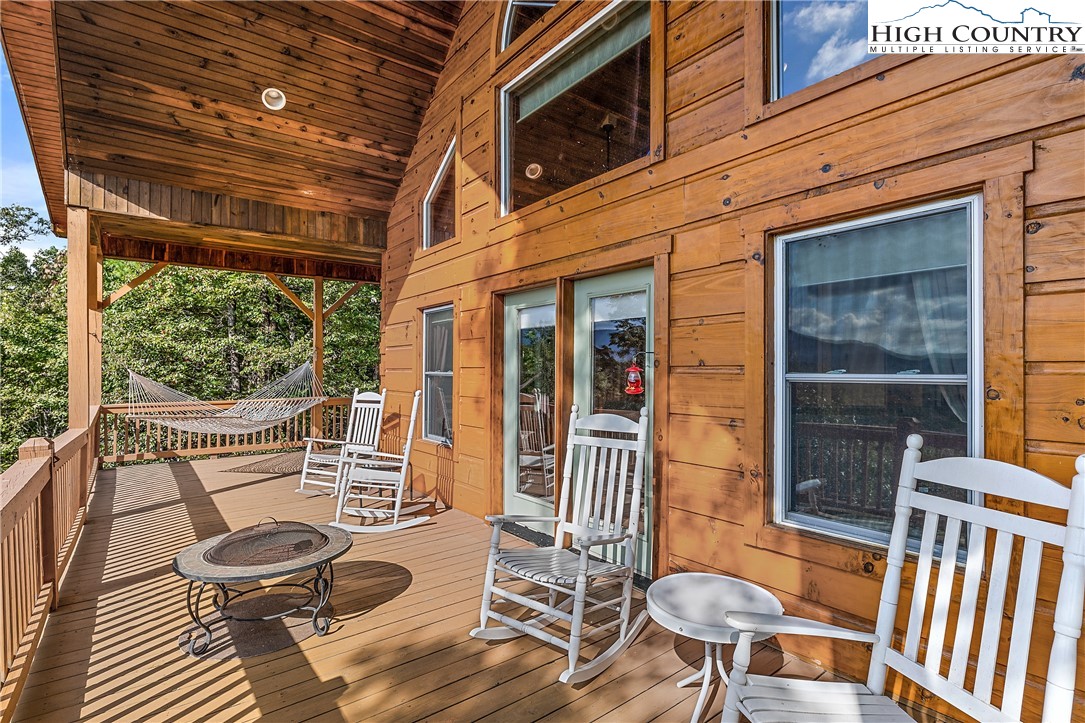 4923 Staghorn Road Purlear, NC 28665 - Photo 12 of 49 a view of a porch with furniture and a yard