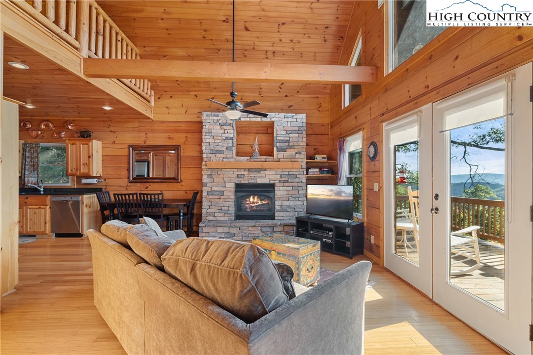 4923 Staghorn Road Purlear, NC 28665 - Photo 14 of 49 a living room with furniture fireplace and flat screen tv