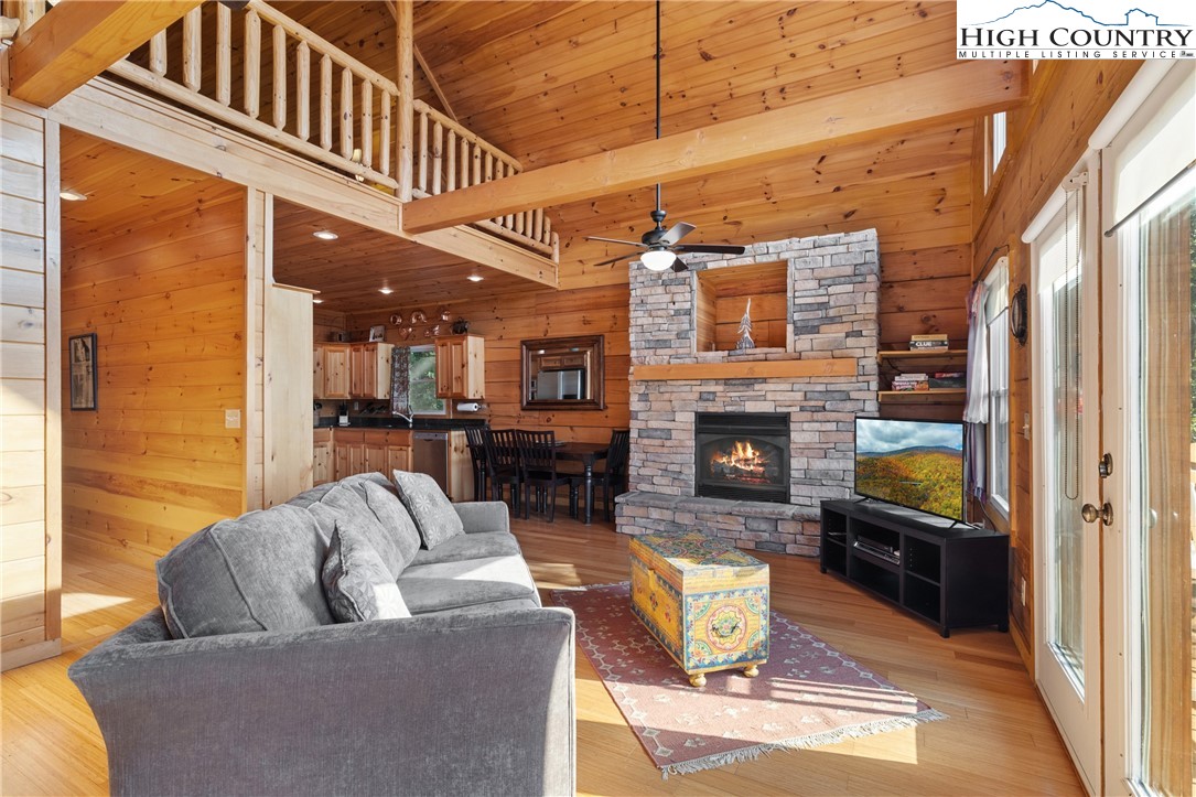 4923 Staghorn Road Purlear, NC 28665 - Photo 16 of 49 a living room with furniture and a fireplace