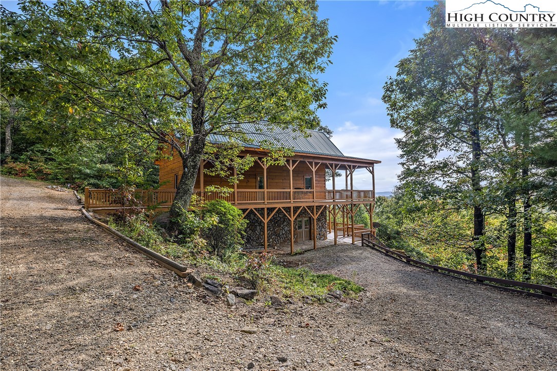 4923 Staghorn Road Purlear, NC 28665 - Photo 2 of 49 a front view of a house with garden