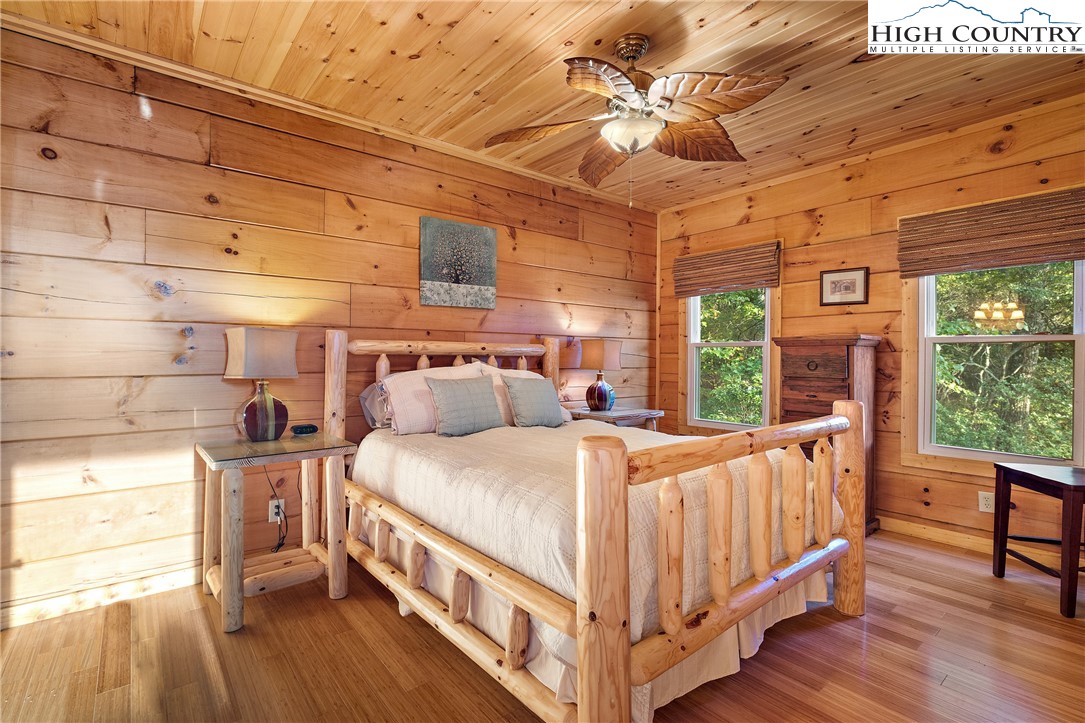 4923 Staghorn Road Purlear, NC 28665 - Photo 30 of 49 a bedroom with a bed next to a large window