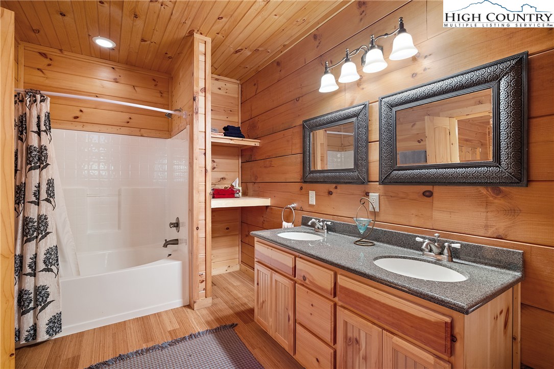 4923 Staghorn Road Purlear, NC 28665 - Photo 34 of 49 a bathroom with a sink and a mirror