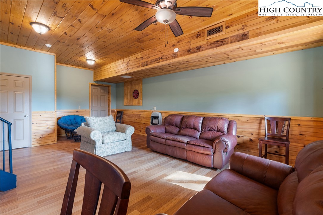 4923 Staghorn Road Purlear, NC 28665 - Photo 40 of 49 a living room with furniture and a wooden floor