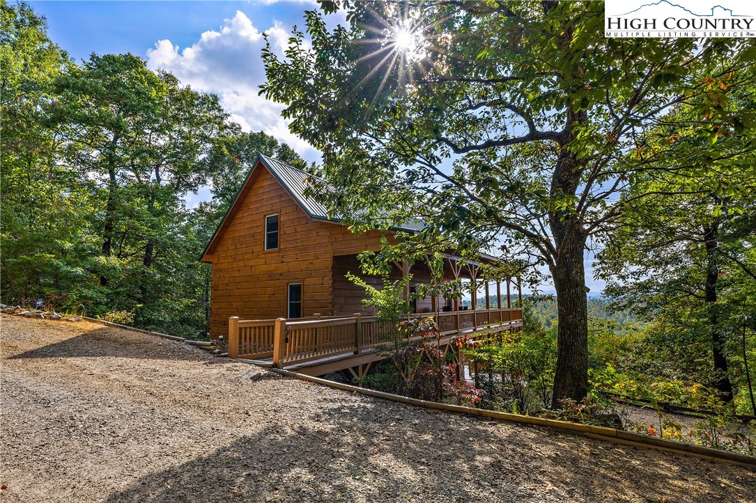 4923 Staghorn Road Purlear, NC 28665 - Photo 6 of 49 a view of a house with a wooden fence