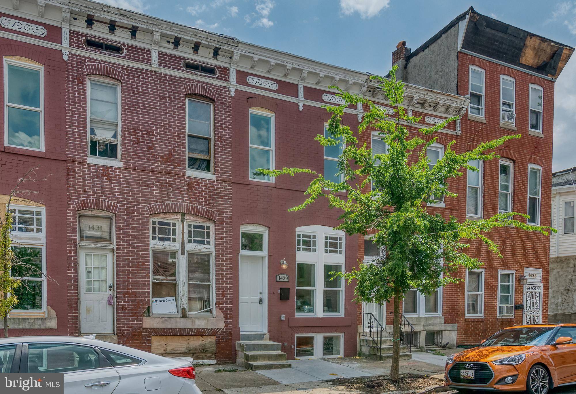a front view of a building with street view