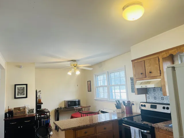 a bedroom with a bed and a potted plant