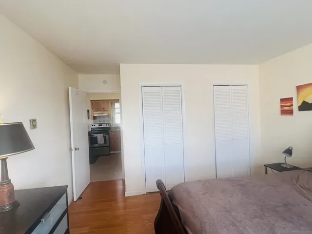 a bathroom with a toilet a sink and a mirror