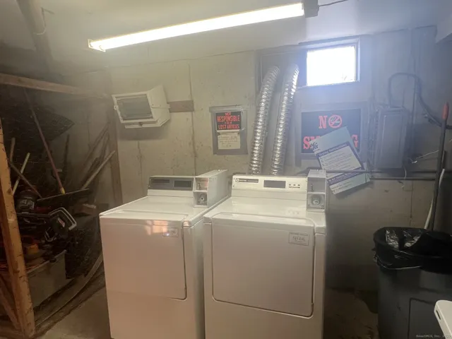 a view of a hallway with wooden floor and stairs
