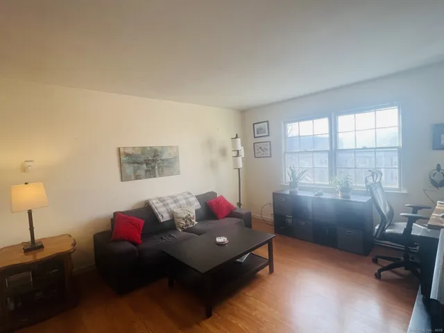 a bedroom with furniture and a window