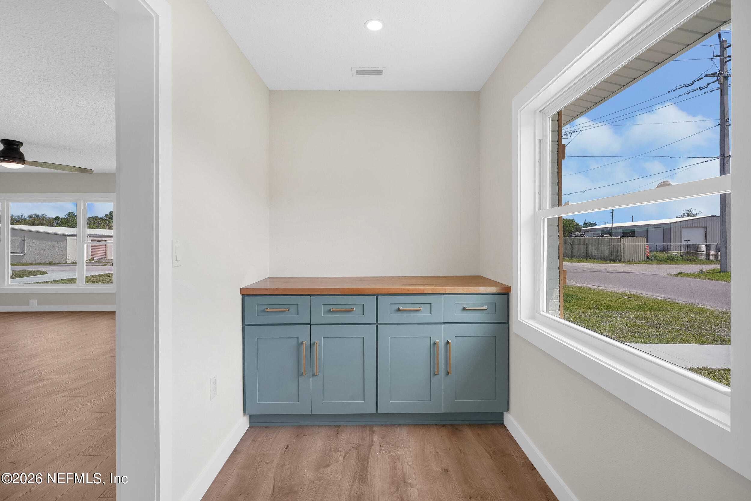 1132 5th Street St. Augustine, FL 32095 - Photo 14 of 34 a view of cabinets with wooden floor