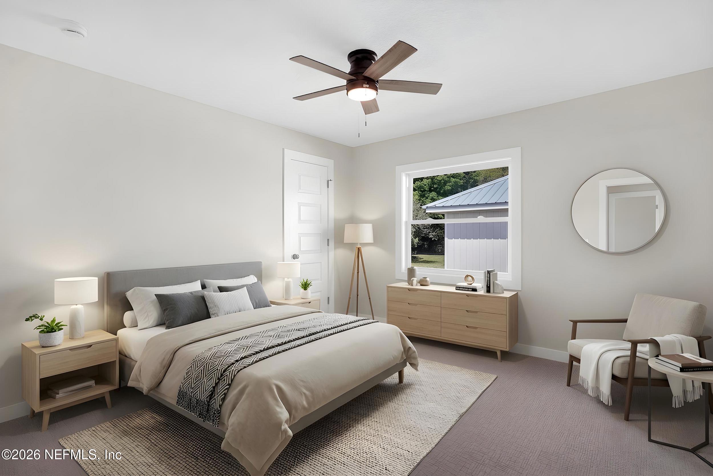 1132 5th Street St. Augustine, FL 32095 - Photo 17 of 34 a bedroom with bed and a chandelier