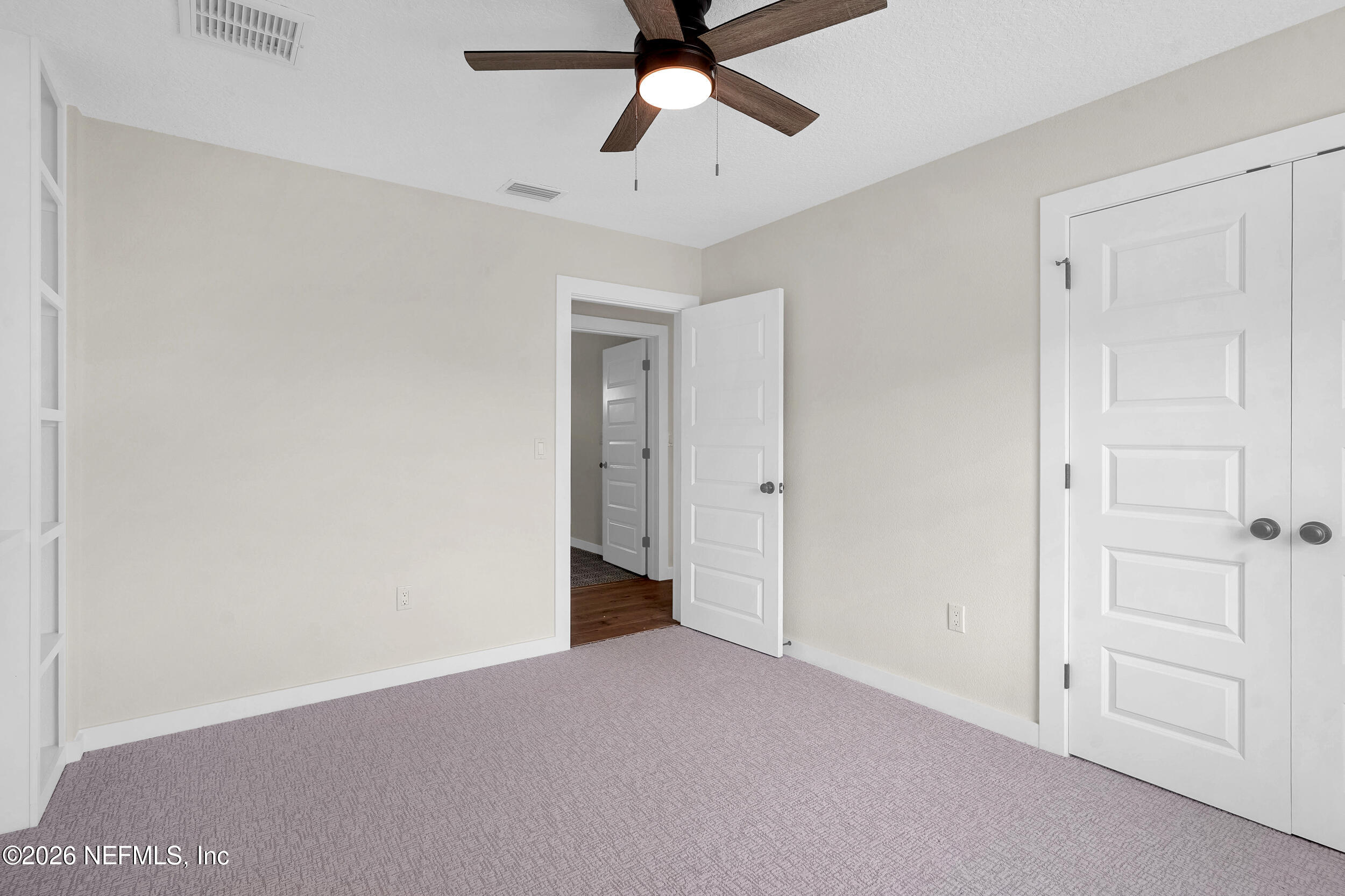 1132 5th Street St. Augustine, FL 32095 - Photo 18 of 34 a view of an empty room and chandelier fan