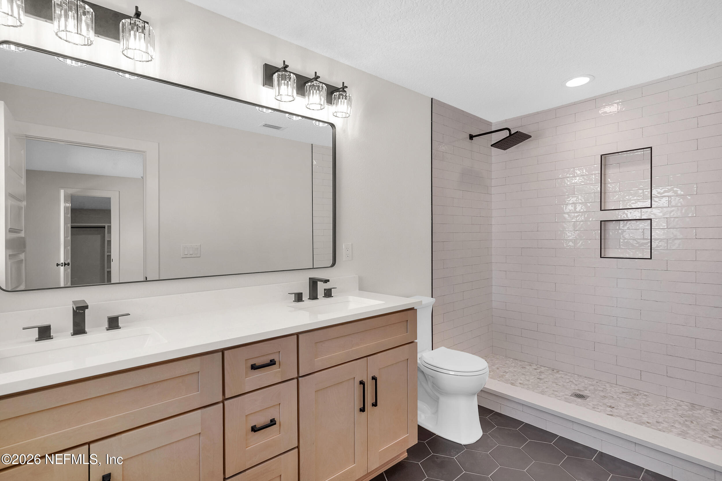 1132 5th Street St. Augustine, FL 32095 - Photo 23 of 34 a bathroom with a double vanity sink toilet and shower