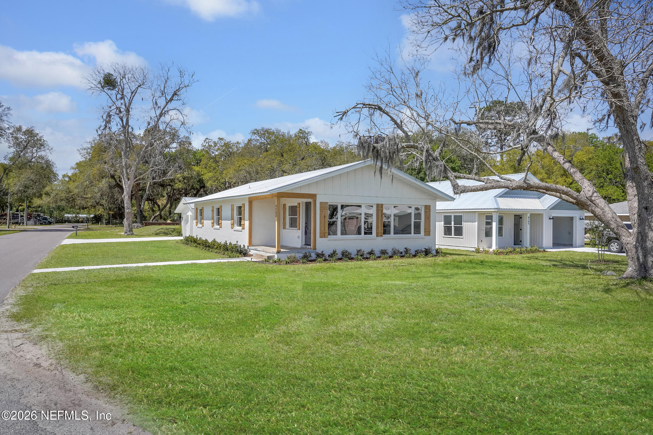 1132 5th Street St. Augustine, FL 32095 - Photo 3 of 34 a front view of a house with garden
