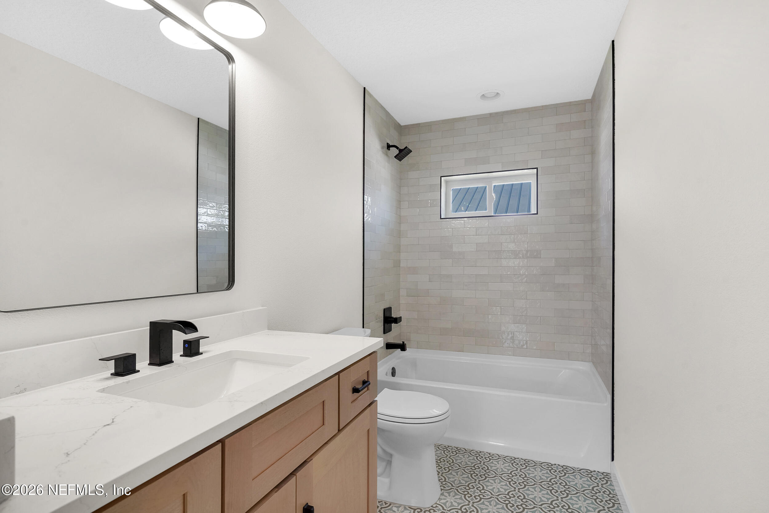 1132 5th Street St. Augustine, FL 32095 - Photo 31 of 34 a bathroom with a sink a toilet and shower